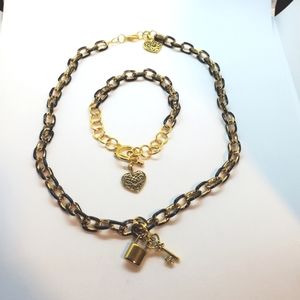 Women's handmade custom jewelry charm bracelet and necklace set.